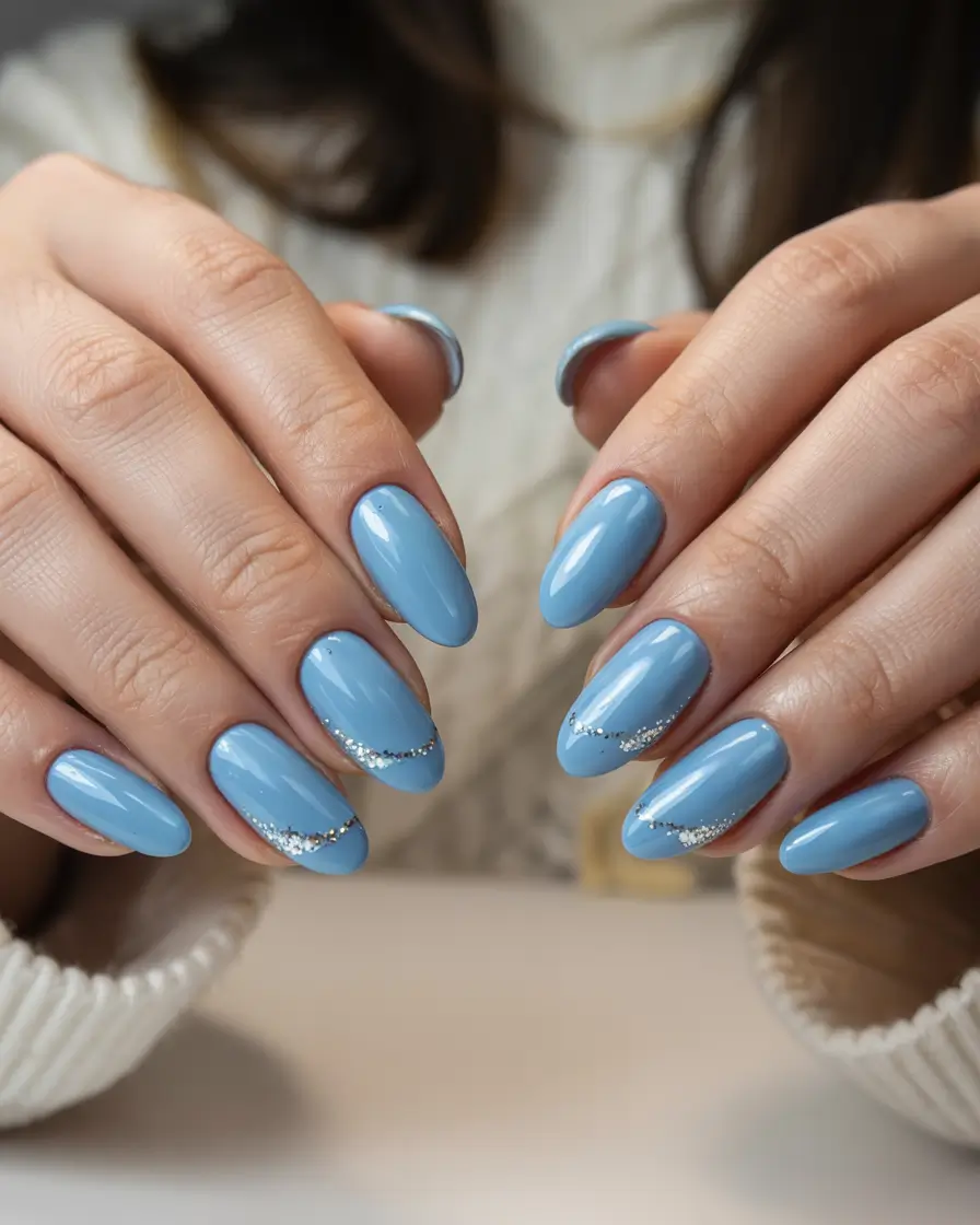 blue winter nails Almond Sky Blue with Sparkling Swirls