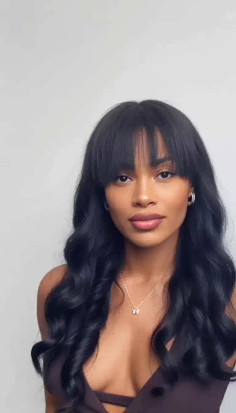 winter hairstyles for black women with bangs Soft Waves with Curtain Bangs