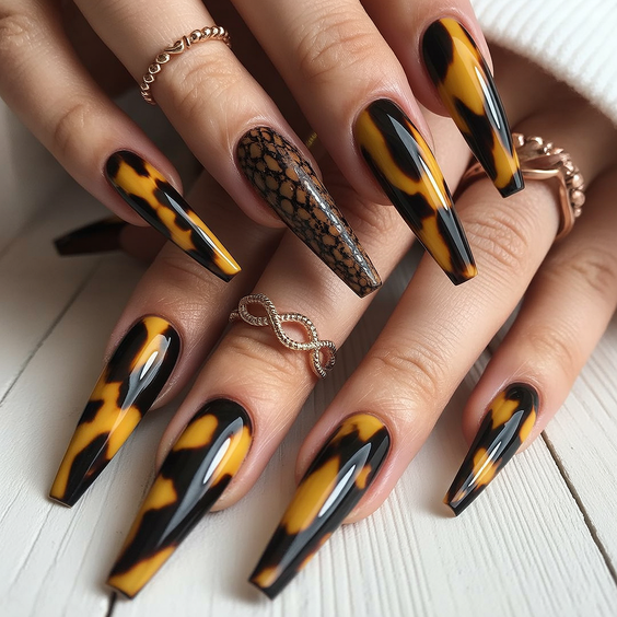 coffin nail designs 2026 Amber And Black Coffin Nails With Tortoiseshell Effect