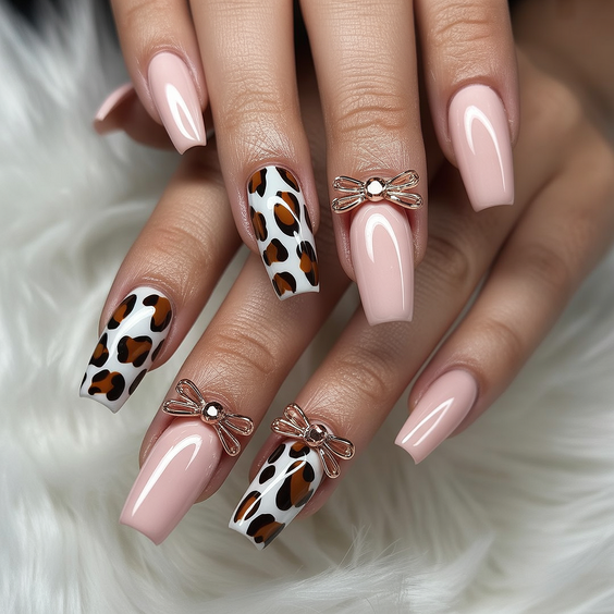 coffin nail designs 2026 Soft Pink Coffin Nails With Leopard Accent And Bow Details
