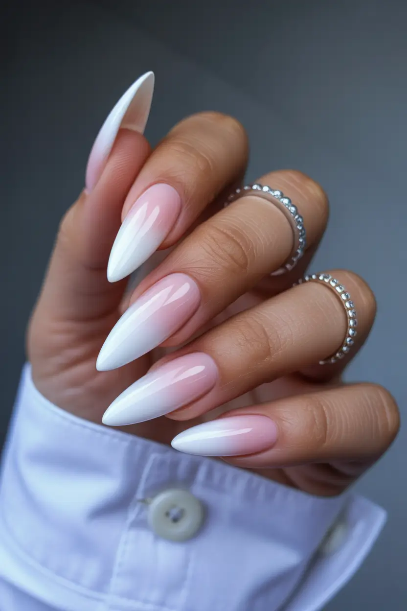 gel nail designs 2026 Milky ombre stiletto nails with a soft gradient finish